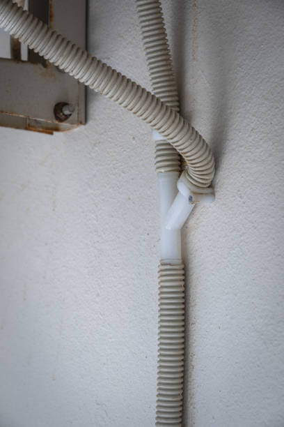 istock drain hose under air conditioner. attached to the wall. 1698255372