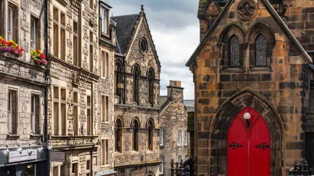 Old stone buildings and medieval appearance in the downtown monumental city of Edinburgh, Scotland