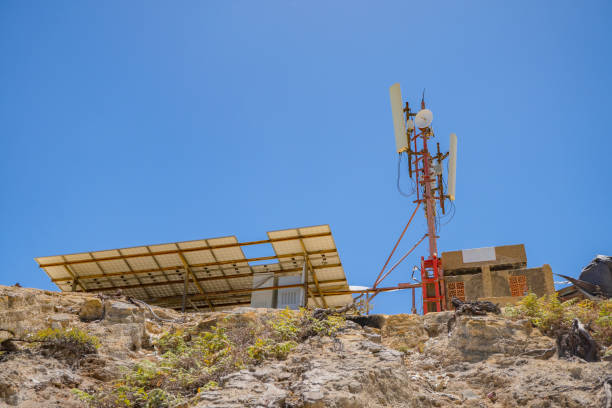 istock Solar panel and telecommunication tower on the peak of mountain. 1698289648