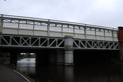 River in Shrewsbury with railway bridge