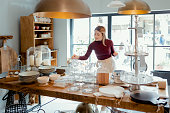 Woman Shopping in Stylish Boutique Full of an Assortment of Housewares