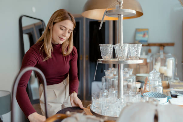 istock Arranging Home Accessories in Home Decor Store 1698298046