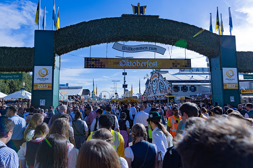 Oktoberfest, Theresienwiese, Munich, Bavaria, Germany, September 2023, main enrance to the festival area with hundreds of people going through