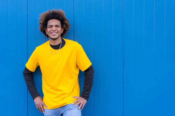 istock Cool african american young man standing and smiling 1698306706