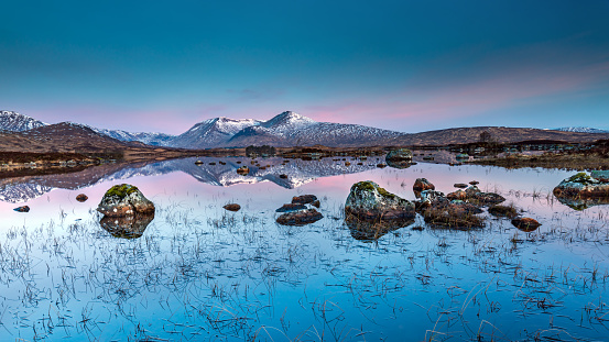 A clear, still spring morning at Lochan na h-Achlaise, Rannoch Moor, Highlands of Scotland, with the Black Mount in the distance.