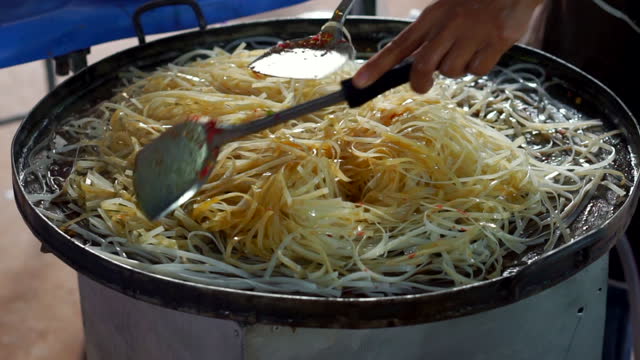 Pad Thai in a hot pan.