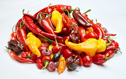 Chili pepper isolated on a white background. One chili hot clipping path. Fresh pepper. Fresh red chili pepper isolated on white background. Chili hot pepper whole. raw food ingredient concept