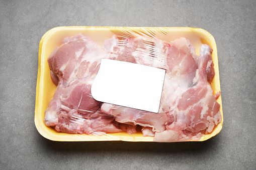 Chicken meats. Package of chicken legs with empty label (Label has Clipping Path)