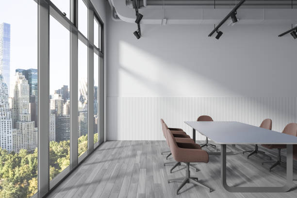 istock White conference room interior with table and armchairs, window. Mock up wall 1698340473