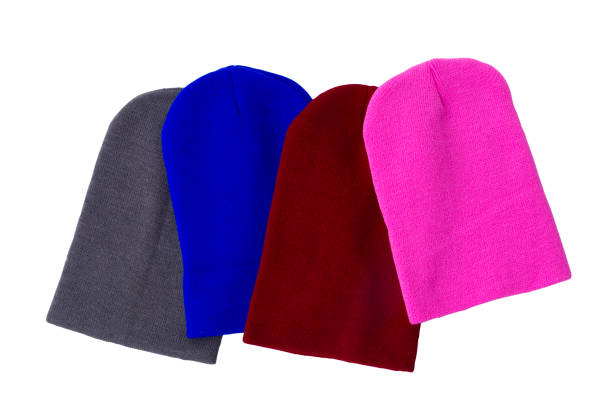 Colourful knitting wool hats isolated on white