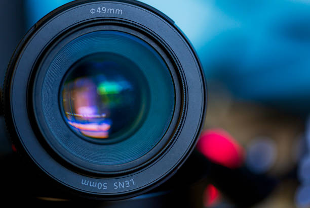 istock macro camera lens,Photo Camera or Video lens close-up on black background DSLR objective 1698371925