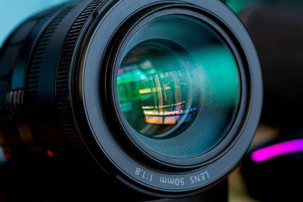 istock macro camera lens,Photo Camera or Video lens close-up on black background DSLR objective 1698371936