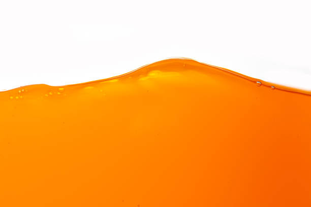istock Orange juice isolated on white background,orange juice is isolated on white background. healthy fresh drink and natural waves. close up view 1698372496