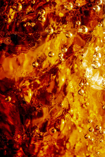 istock macro cola drink texture,macro cola background,Background of cola with ice and bubbles. Side view background of refreshing cola flavored soda with carbonated with vintage tone,Thailand, Turkey - Middle East, Cola, Soda, Bubbl 1698373578