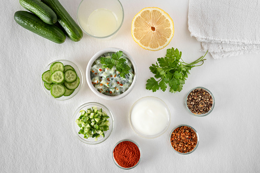 preparation of cucumber salad with fromage blanc and spices