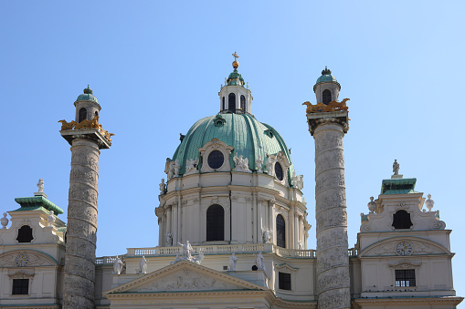 25 October 2019 Vienna, Austria -Wiener Karlskirche / Saint Charles's Church. Many tourists on streets. Art landmark.