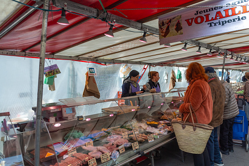 Paris, France, 23th of September 2023, People buying meat at a butchery of Marché de Montparnasse.  Editorial only.