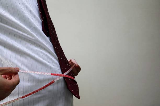 istock Image of a fat businessman 1698405509