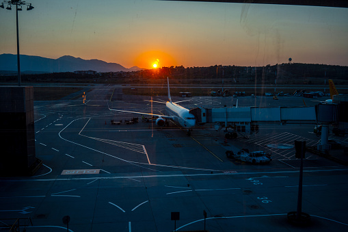 airplane is in apron at sunrise time horizontal transportation still