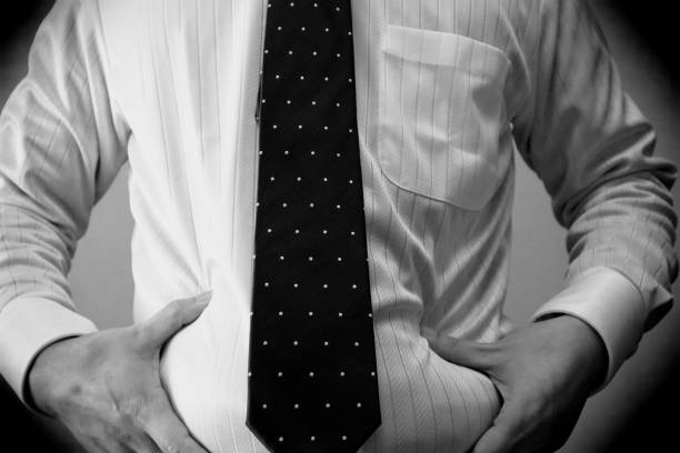 Copy space image of bearded man tying a necktie.