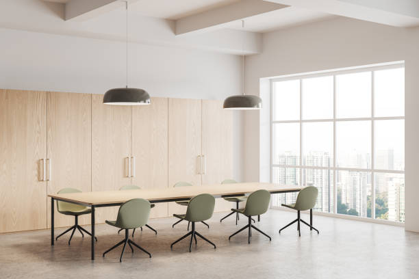 istock Stylish meeting room interior with chairs and table, panoramic window 1698414661