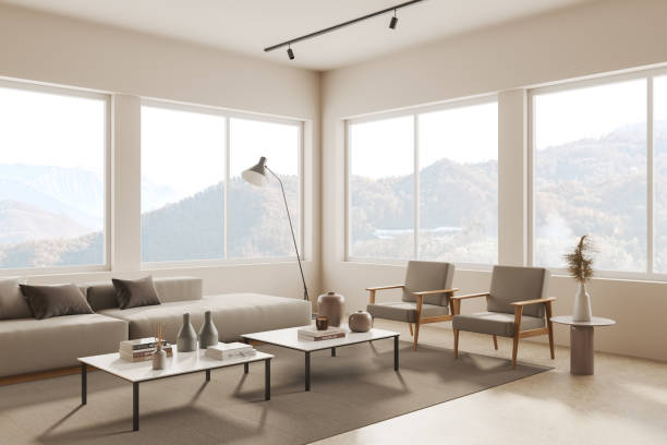 istock Beige living room interior with couch and armchairs with coffee table, window 1698415217