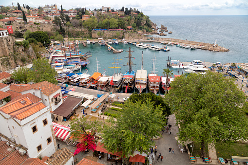 Aerial view of yachts and boats in marina, old town Kaleici in district Antalya.