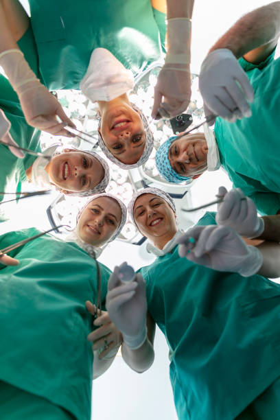 istock Team of nurses and surgeons in surgery. 1698426948