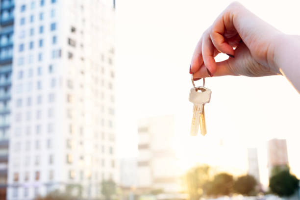 istock Real estate concept with home keys in hand 1698438081