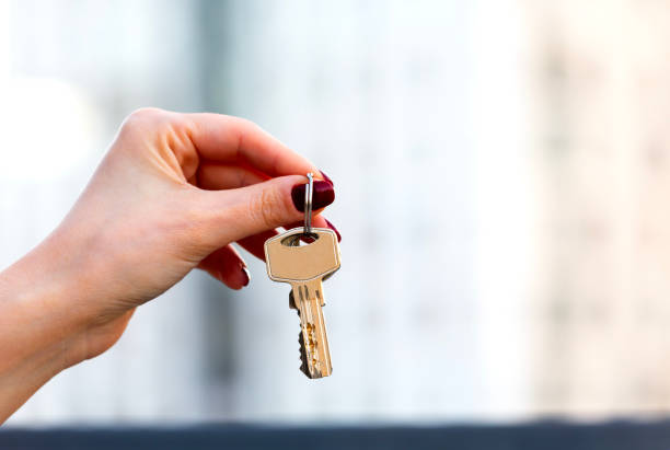istock Real estate concept with home keys in hand 1698438084