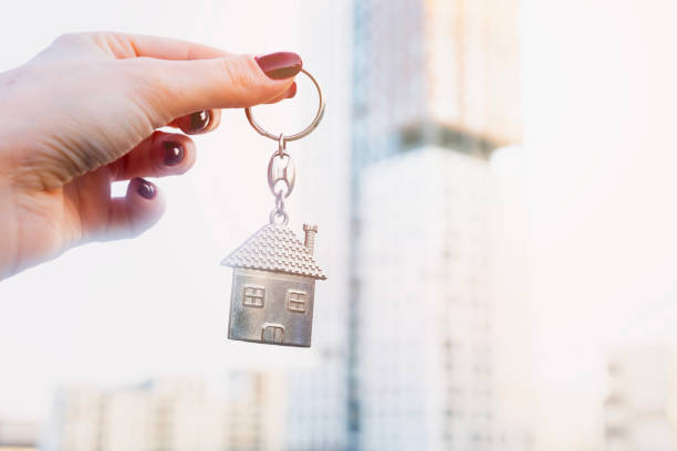 istock Real estate concept with home keys in hand 1698438661