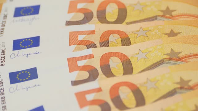 closeup 50 euro banknotes of european union, concept of savings, banking, tax payment, economic cooperation, actual problems of money and monetary circulation, save up for vacation, cash out currency