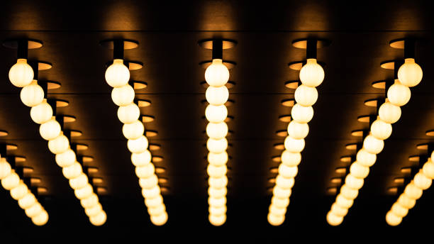 Rows of illuminated globes under the marquee as often used at the entrance to theatres and casinos stock photo