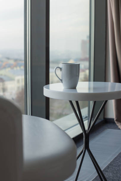 istock cup of tea on white table near  window 1698473045