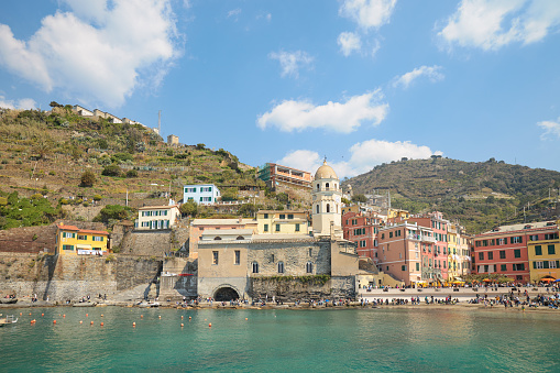This title suggests a photo that captures the beauty of Vernazza, a picturesque village in Cinque Terre, Italy, during the golden hour, a period of soft and warm sunlight before sunset.