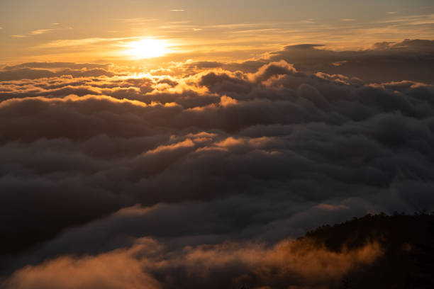 istock The sun rising from a sea of clouds 1698480055