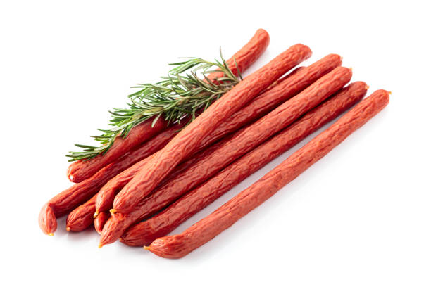 istock Smocked sausages with rosemary isolated on white. 1698496240