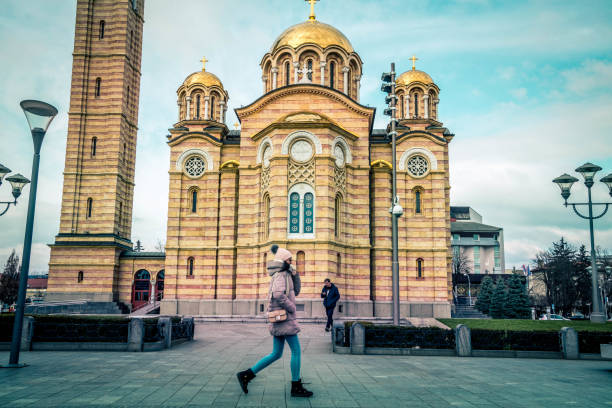 Banja Luka,  Bosnia and Herzegovina - February 6, 2023:  A woman walks in front of the Christ the Savior Orthodox Cathedral.