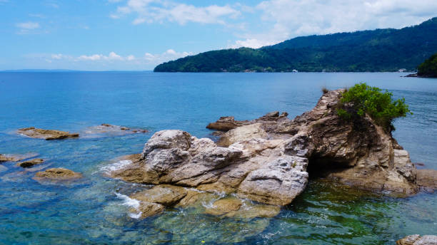 istock Rocky coast of a tropical island. 1698516495