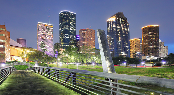 Houston Texas Skyline with modern skyscrapers and blue sky view from park river US