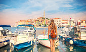 Woman tourist looking at city of Rovinj in Croatia, Dalmatia- tour tourism,vacation,travel destination-Europa