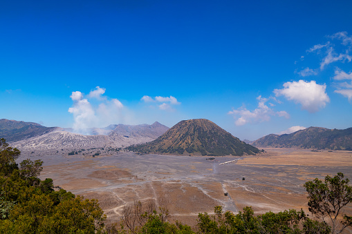 Amazing Mount Bromo volcano during sunny sky from viewpoint on Mountain Penanjakan in Bromo Tengger Semeru National Park,East Java,Indonesia.Nature landscape background