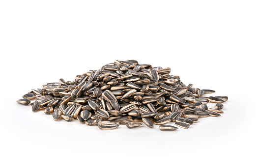 Heap of sunflower seed on white background