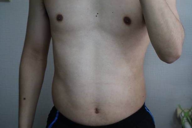 istock Japanese man with belly fat 1698593357