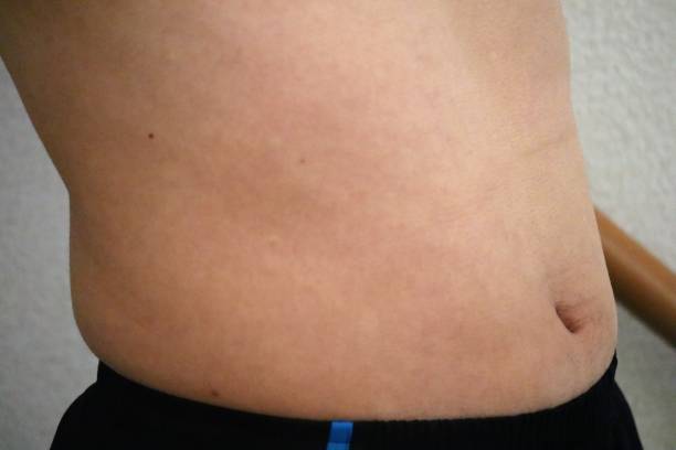istock Japanese man with belly fat 1698599896