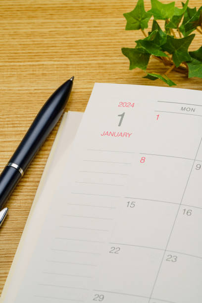 istock 2024 Notebook and pen on wooden table 1698605903