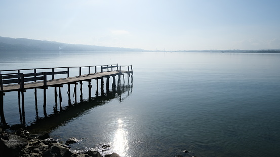 Small dock at the sea in the morning, viewed from side