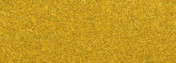 istock YELLOW GLITTER sparkling background with bright reflections and many small lights 1698618340