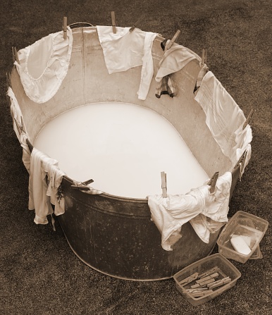 washtub with clothespin and clothes with old toned sepia effect without people