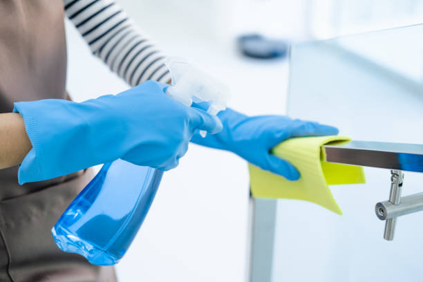 istock Maid cleaning stairway rail by using alcohol and liquid cleaning solution. alway cleaning equipments in daily life. Sanitation and healthcare. 1698676830